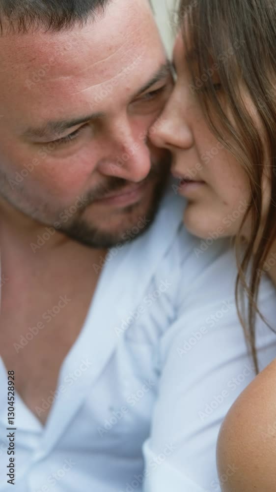 Man and woman in love feeling happy and romantic, hugging on sandy beach. Man and woman in love feeling happy and romantic, hugging on sandy beach.