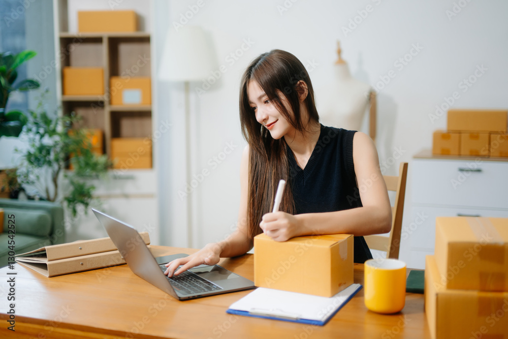 Startup small business SME, Entrepreneur owner woman using smartphone or tablet taking receive Startup small business SME, Entrepreneur owner woman using smartphone or tablet taking receive