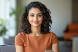 a indian woman with shoulder-length curly hair, wearing a business casual dress