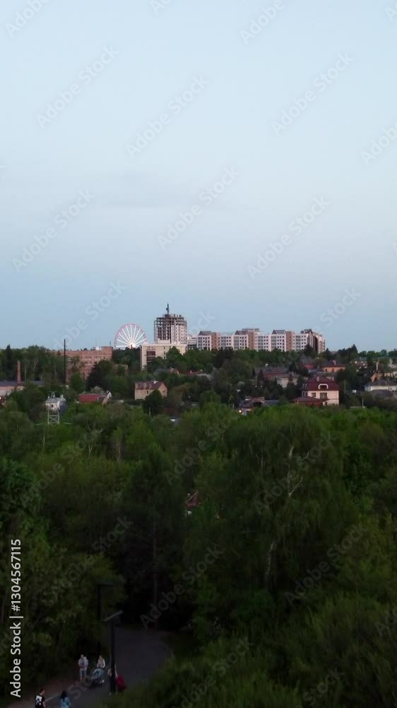 Aerial view on green park in evening city residential district Aerial view on green park in evening city residential district