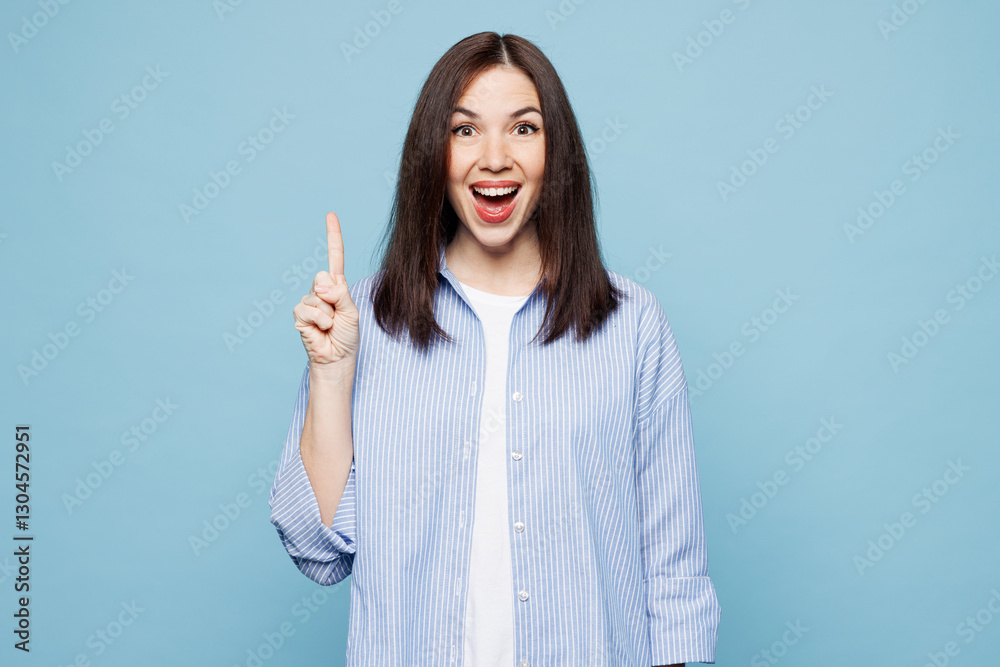 Young insighted smart proactive woman she wears shirt casual clothes holding index finger up with great new idea isolated on plain pastel light blue cyan background studio portrait. Lifestyle concept.