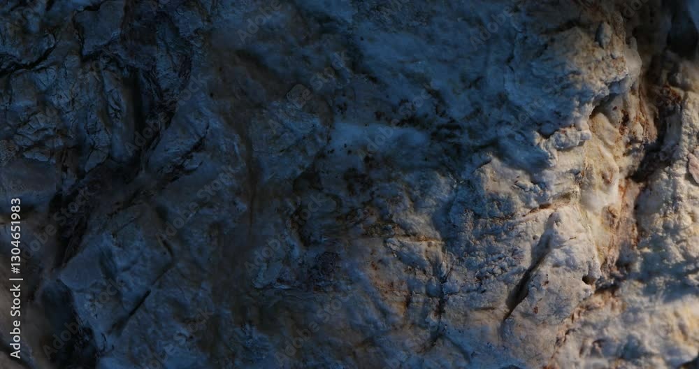 Rock Surface with Blue Shadows and Warm Light Contrast Rock Surface with Blue Shadows and Warm Light Contrast