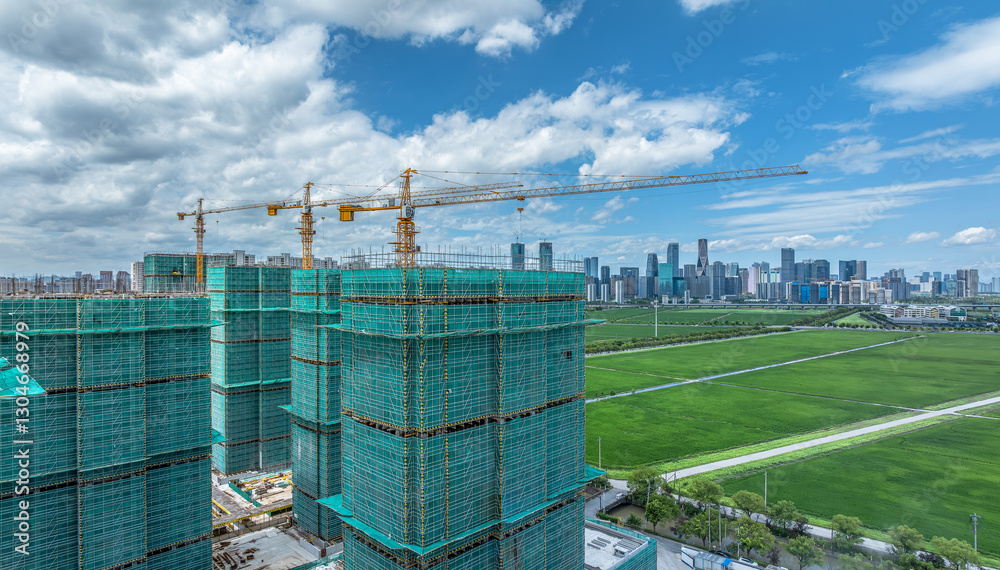 Construction site with buildings and cranes in modern city Construction site with buildings and cranes in modern city