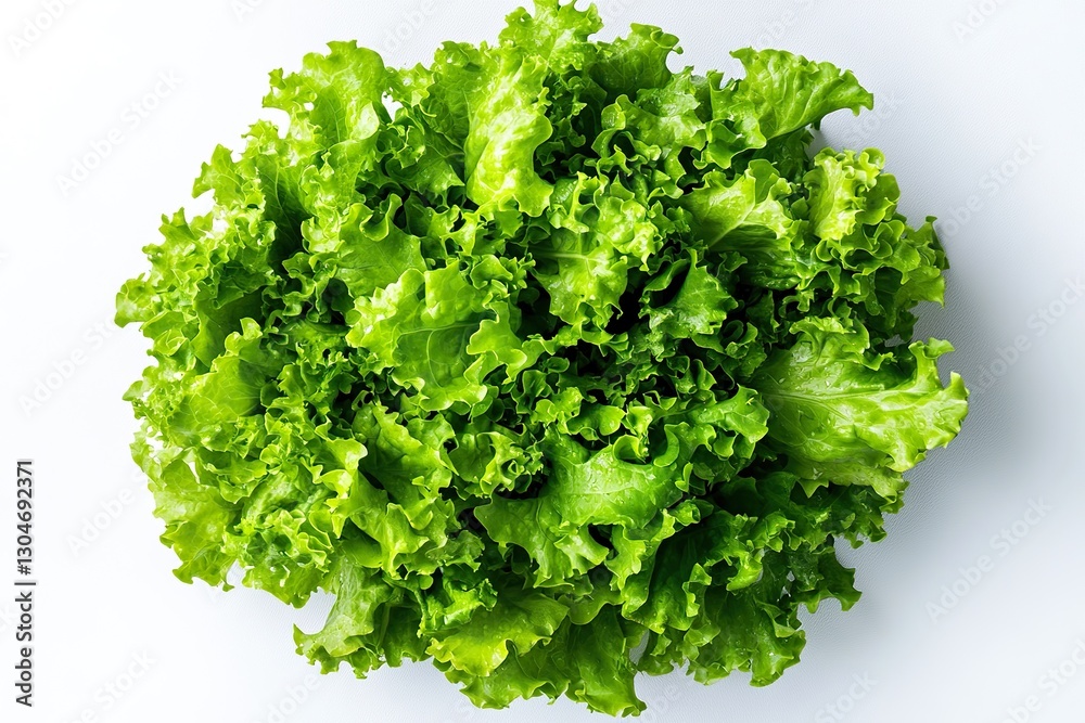 Obraz premium Green lettuce salad arranged in top view on white background. Fresh food photography for vegan menus, diet plans, or restaurant advertisements