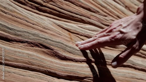 Hand following the lines of the wave arizona