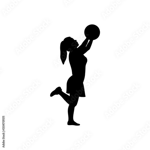 Silhouette of woman jumping and holding basketball
