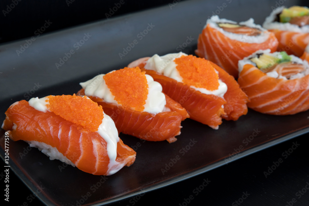 Salmon nigiri with cream cheese and crab roe Salmon nigiri with cream cheese and crab roe