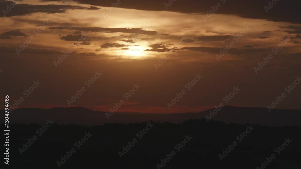 Sunset sky with slow moving clouds across moody sky Sunset sky with slow moving clouds across moody sky
