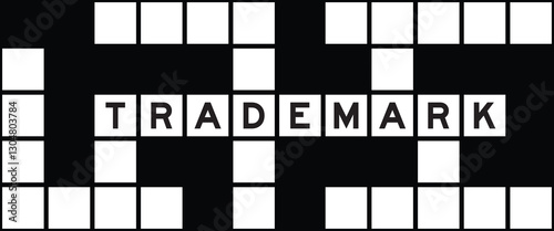 Alphabet letter in word trademark on crossword puzzle background