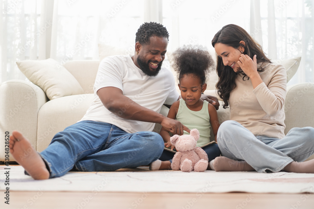 Loving interracial family sitting on floor,playing with kid in living room,bonding african kid with father and mother at home Loving interracial family sitting on floor,playing with kid in living room,bonding african kid with father and mother at home