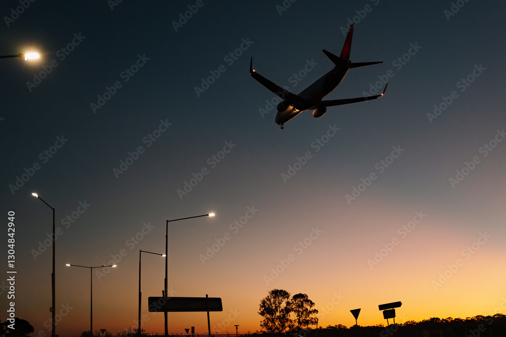 Silhouette of commercial airplane flying in the sky at sunset Silhouette of commercial airplane flying in the sky at sunset