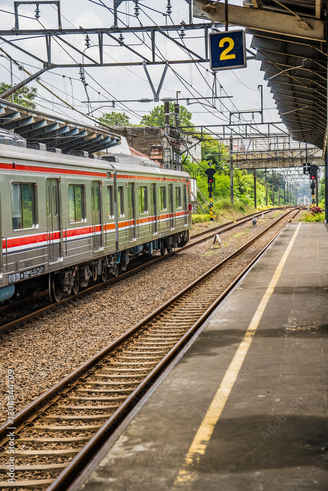 Fototapeta premium Display the side of the electric train car enters the train station.