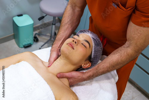 Healthcare professional providing a soothing neck massage to a asian female patient in a calming clinic environment, promoting relaxation and wellness