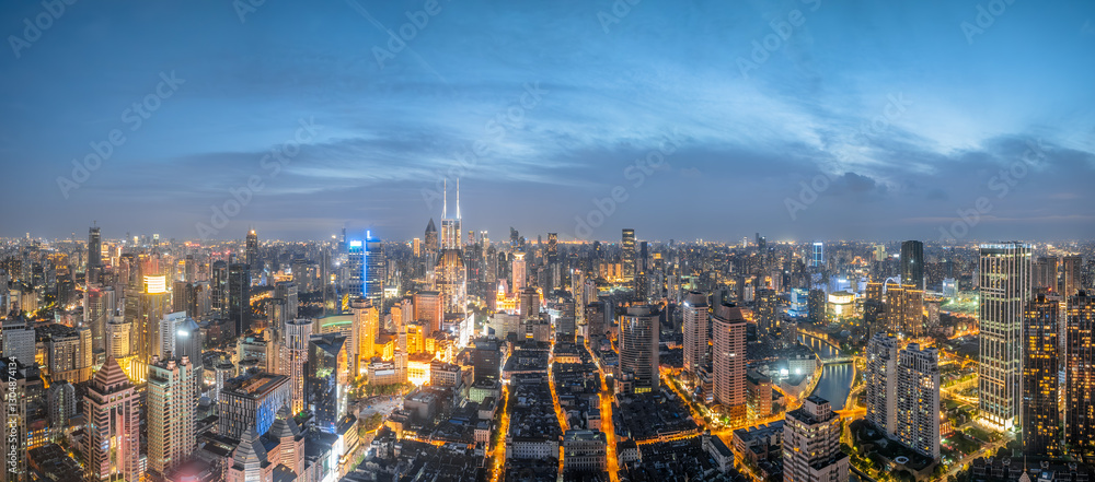 Fototapeta premium Panoramic aerial view of city skyline and commercial buildings at night in Shanghai