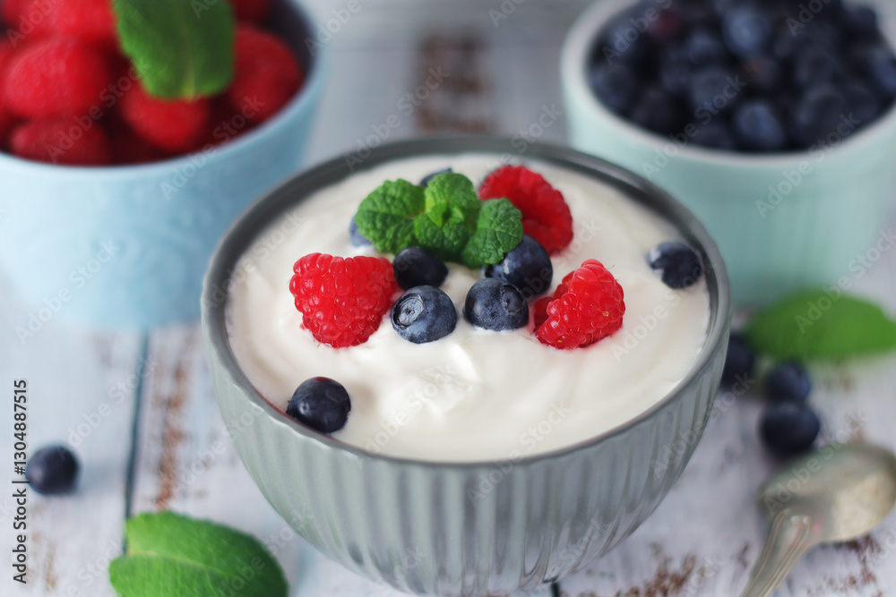 A bowl with Greek yogurt with berries A bowl with Greek yogurt with berries