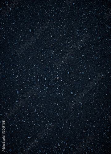 Asphalt background texture with some fine grain and dotty pattern. Dark Asphalt Texture
