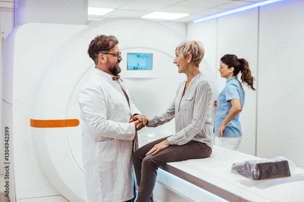 Fototapeta premium Doctor Consulting Elderly Patient During MRI Scan in a Medical Facility