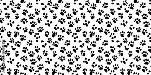 Stylized seamless pattern featuring playful black paw prints on a white background for creative design projects. paw print pattern