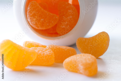 Vitamin C Chewable Gummies Spilled from a Bottle