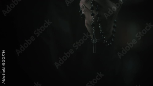 religious person with beads in hands