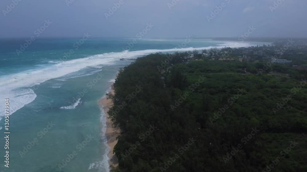 Aerial view of powerful high waves crashing in the Indian Ocean during a cyclone in Mauritius, capturing the intensity of the storm Aerial view of powerful high waves crashing in the Indian Ocean during a cyclone in Mauritius, capturing the intensity of the storm