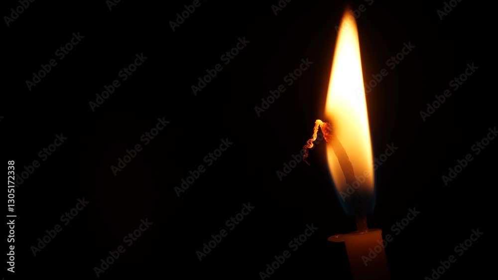 lonely burning candle in the dark , copyspace . church candle burning in the dark lonely burning candle in the dark , copyspace . church candle burning in the dark