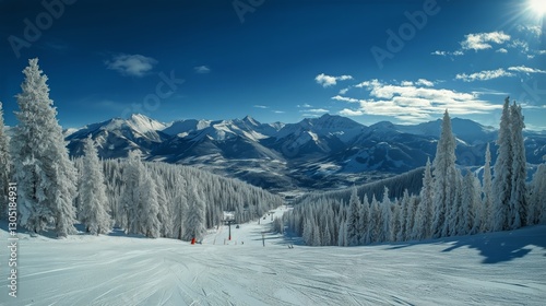 Winter Ski Lift With Snow-Covered Trees and Mountains at Sunset in a Scenic V...