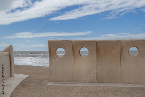concrete windbreak with holes on the seafront at Thornton Cleveleys