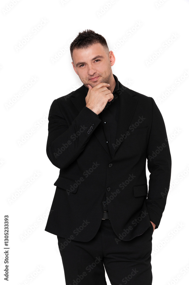 A handsome dark-haired man wearing a business suit, a black shirt on a white background A handsome dark-haired man wearing a business suit, a black shirt on a white background