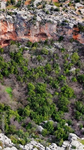 Multiple views of the cennet and cehennem sinkholes in mersin, turkey, showing their unique geological formations and the surrounding landscape photo
