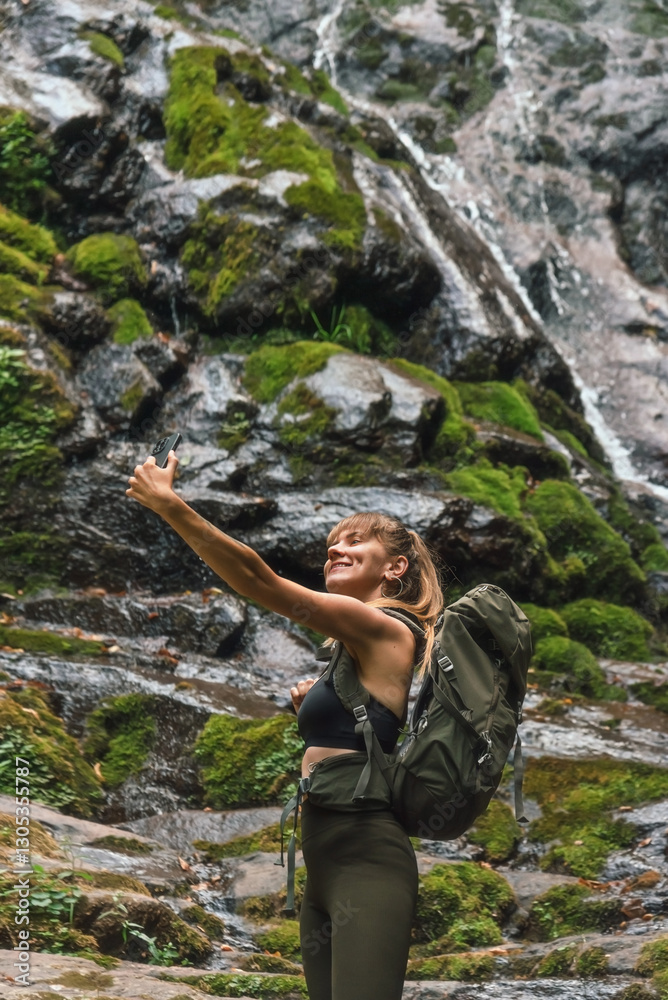 Woman Tourist Taking Selfie Picture near Waterfall