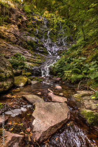 Pilj Waterfall Cascading through Green Mountain Forest