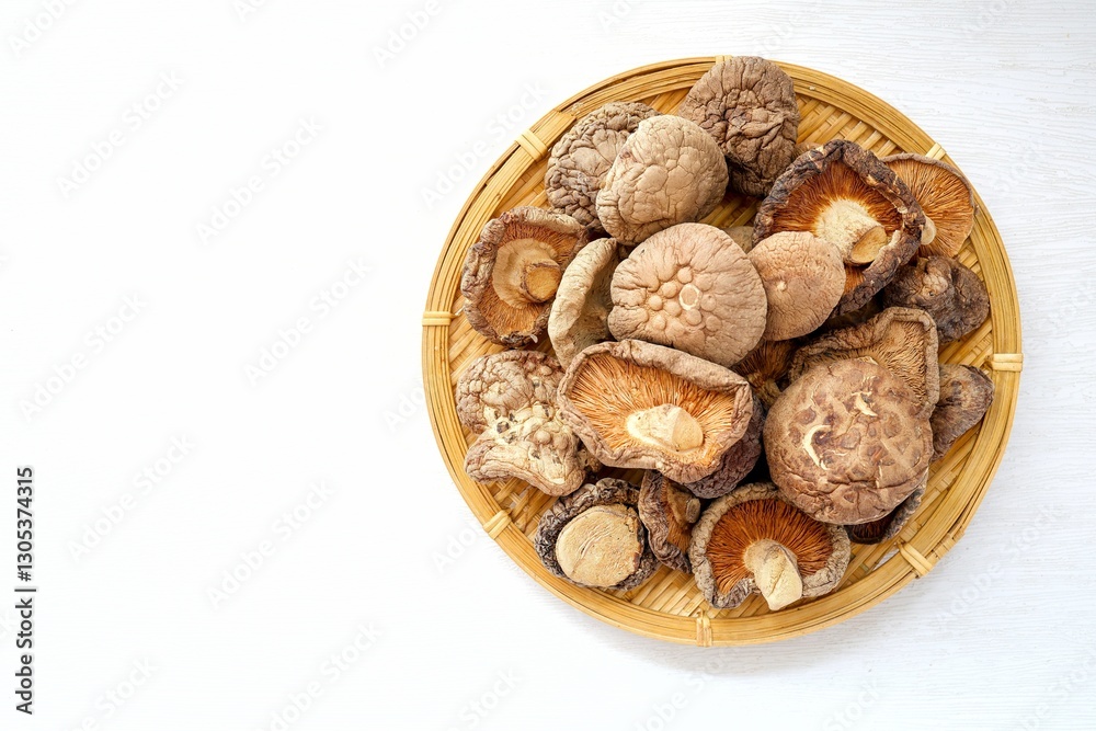 Dried mushrooms in basket , Deied shiitake mushrooms on white background Dried mushrooms in basket , Deied shiitake mushrooms on white background