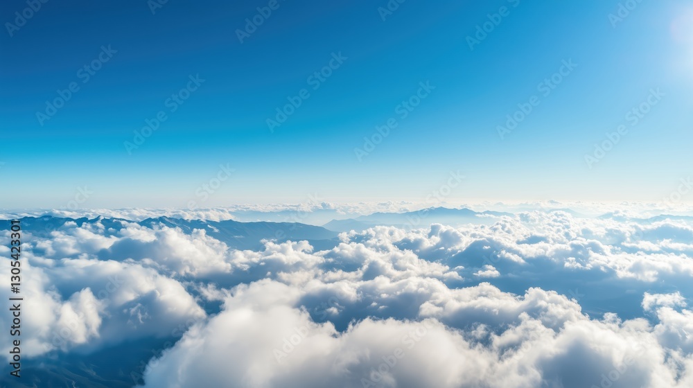 Bright Blue Sky with Soft White Clouds Over Mountain Landscape Bright Blue Sky with Soft White Clouds Over Mountain Landscape