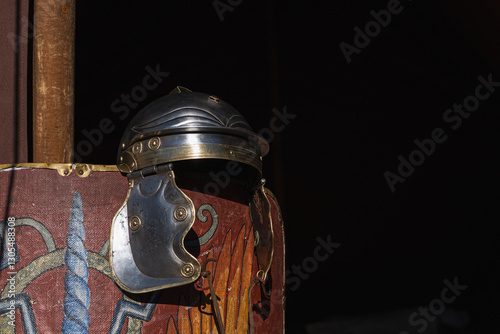 Fotografía Roman Legionary Soldier’s Helmet Resting on a Shield – Iconic Military Symbol