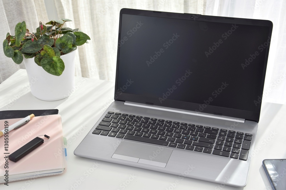 Fototapeta premium Work place at home at a table with a laptop.