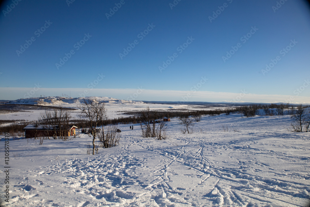 Stunning sunset view over Kiruna city and mine with snow covered trees in Swedish Lapland Stunning sunset view over Kiruna city and mine with snow covered trees in Swedish Lapland