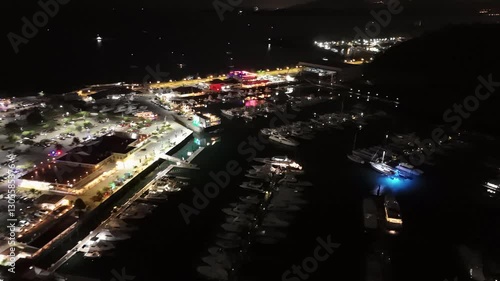 Cinematic aerial view from a drone at night on the Amador Causeway in Panama City, 4K Video