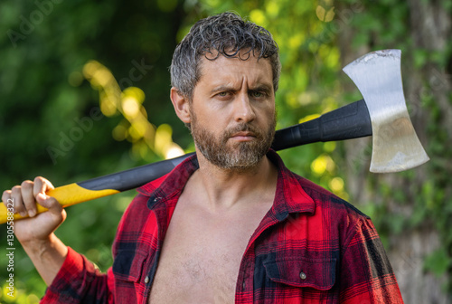 Brutal lumberjack. Brutality and masculinity. Hispanic man logging with axe. Lumberjack axe. Man with logging axe. Hardworking brutal man. Logging lumberjack man outdoor. Bearded woodman