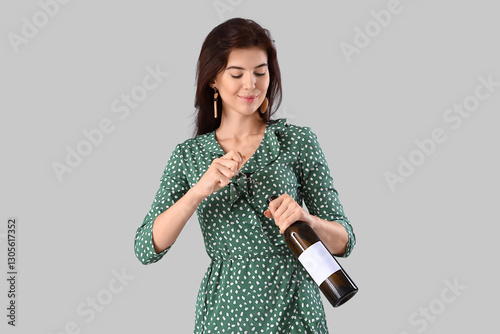 Beautiful young woman openi...