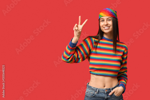 Young happy woman in rainbo...