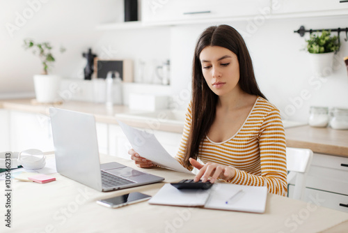 Принти на полотні Lady doing paperwork and using calculator, accounting taxes and planning budget,