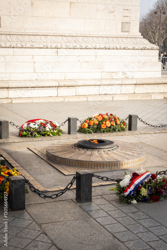 The flame of the unknown soldier under the arches of the Arc de Triomphe in Paris - 1