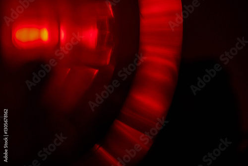 Red light leaks on dark background. Abstract background for design with random shapes. Colorful light streaks for special effects.