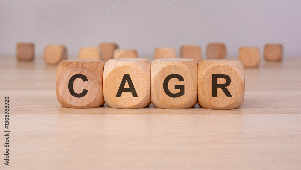 the text CAGR is written on wooden cubes on a brown background the text CAGR is written on wooden cubes on a brown background