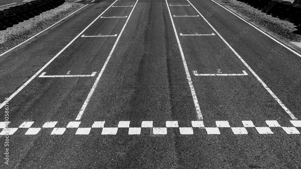 Start or finish line on car race, Start and finish line racing, Grid start race track, Top view textured and background grid start on the asphalt road race track abstract.