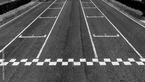 Obraz na płótnie Start or finish line on car race, Start and finish line racing, Grid start race track, Top view textured and background grid start on the asphalt road race track abstract. w salonie