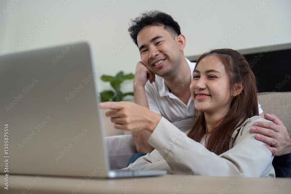 Family sharing a light moment while using a laptop Family sharing a light moment while using a laptop