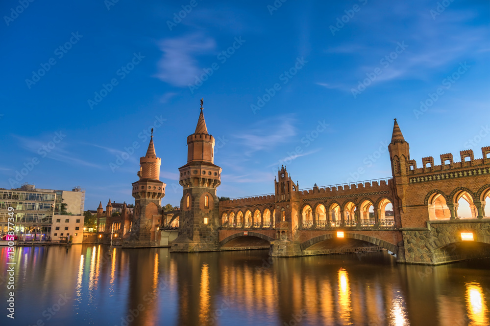 Berlin Germany, sunset city skyline at Oberbaum Bridge and Spree River