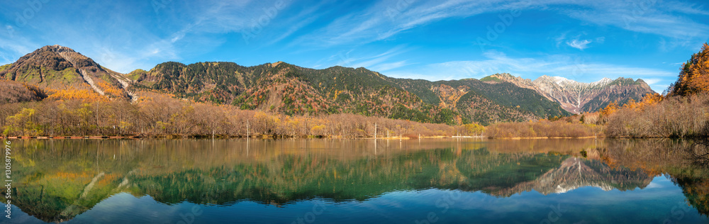 Nature landscape panorama at Kamikochi Japan, autumn foliage season with pond and mountain